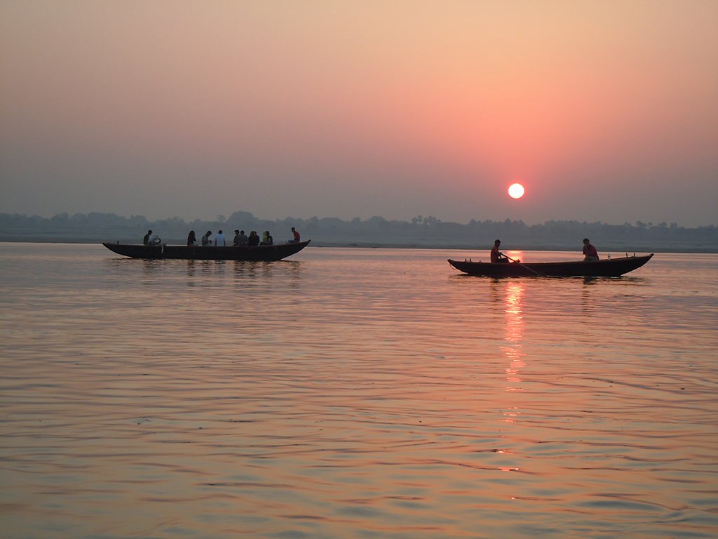 Sunrise boat ride on Ganges river followed by walk through the narrow alleys of 
